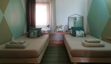 Habitación compartida con dos camas individuales